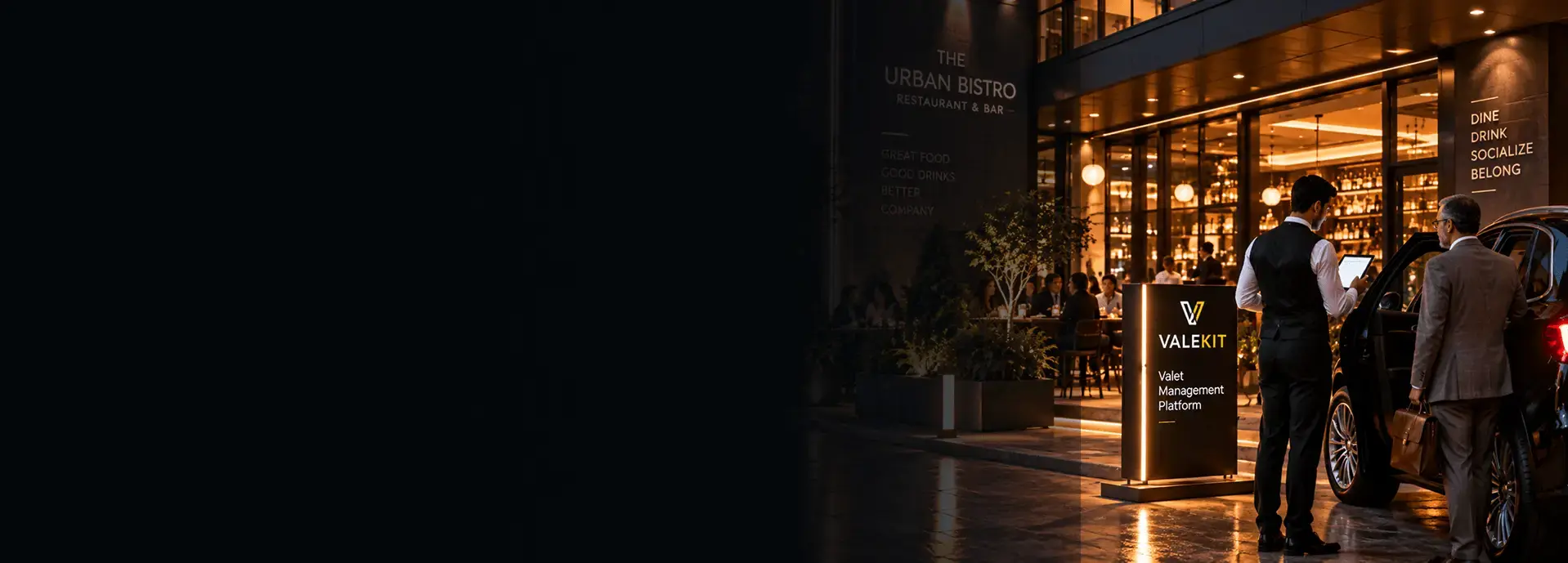 Valet attendant using ValeKit restaurant valet parking software on a tablet at a restaurant entrance at night
