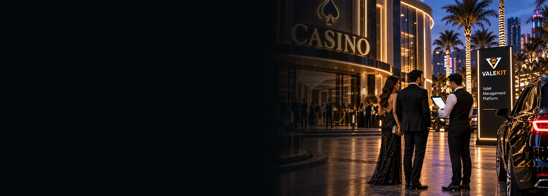 Valet attendant using ValeKit casino valet parking software on a tablet at a casino entrance at night