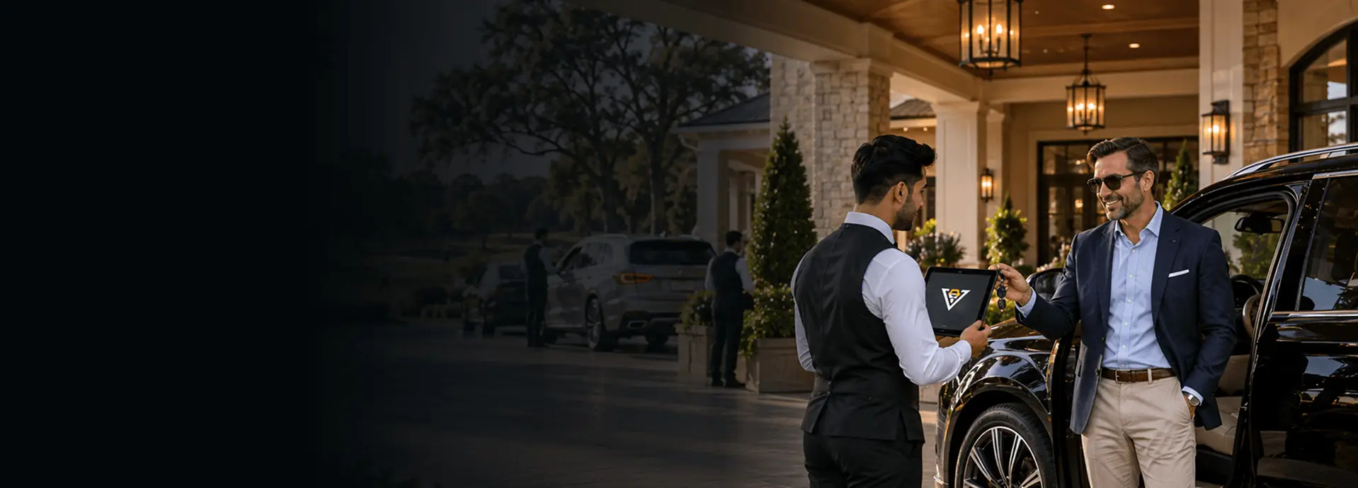 Valet attendant using ValeKit country club valet parking software on a tablet at a country club entrance at night