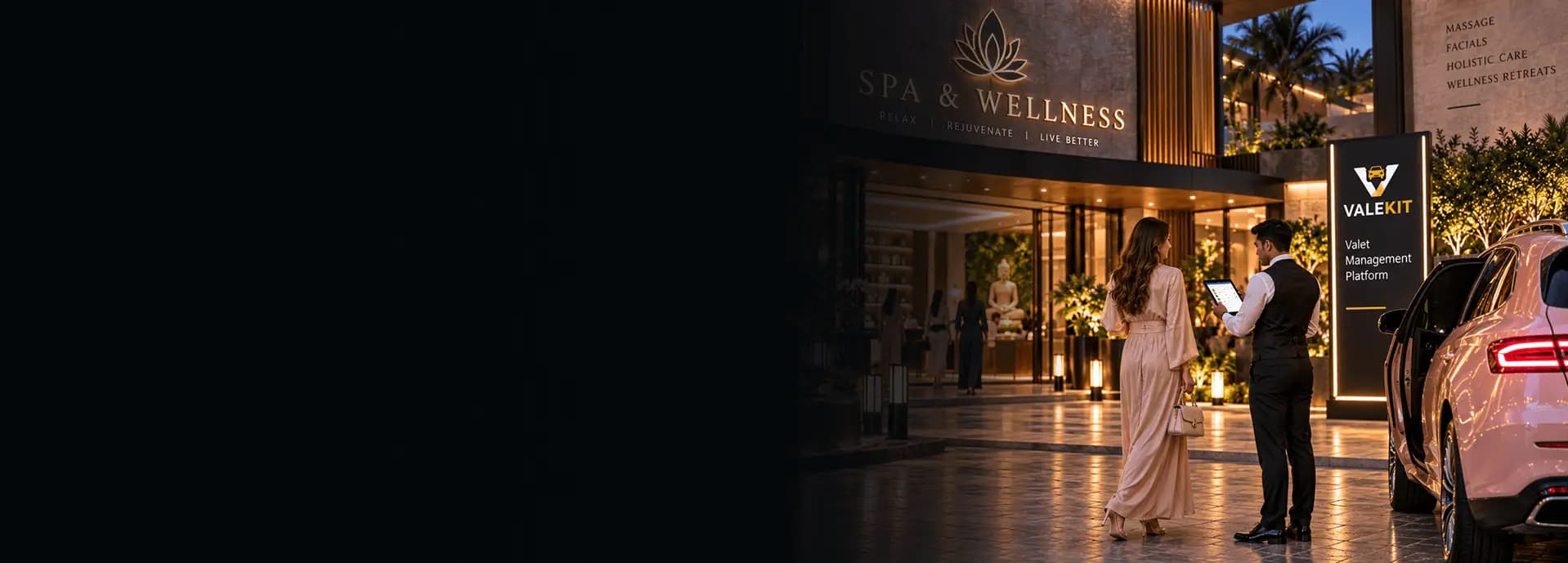 Valet attendant using ValeKit spa valet parking software on a tablet at a spa and wellness entrance at night