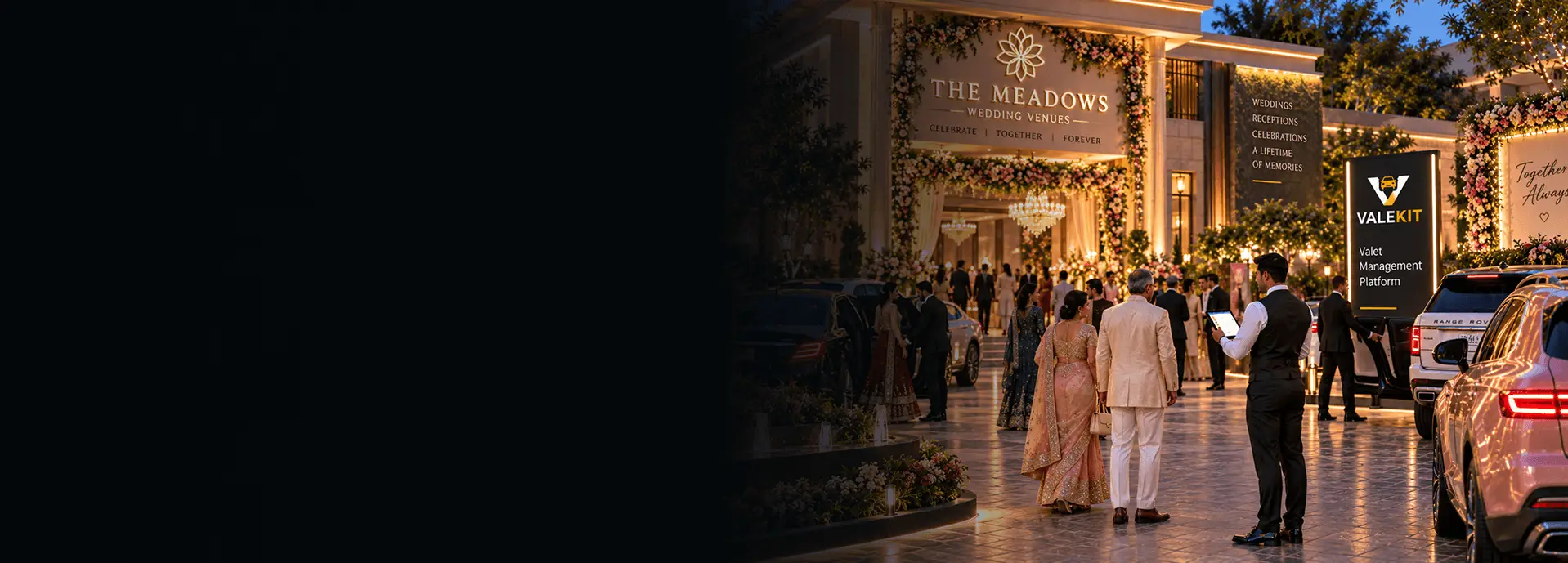 Valet attendant using ValeKit wedding valet parking software on a tablet at a wedding venue entrance at night